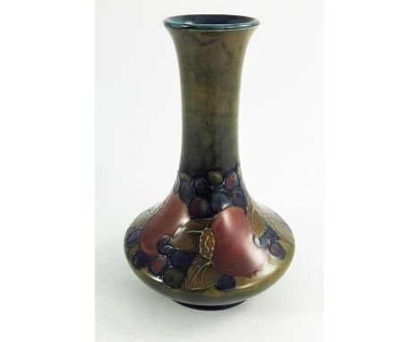 William Moorcroft, a Pomegranate vase, circa 1925, elongated neck angled baluster form, impressed and painted marks, 20cm hig