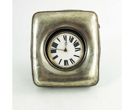An Edwardian silver watch holder with pocket watch, Henry Clifford Davis, Birmingham 1910, plain cushioned rectangular form w