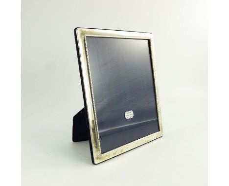 An Elizabeth II large silver photo frame, Carr's of Sheffield, Sheffield 1995, rectangular form with long and short beaded bo
