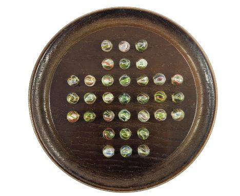 A boxed Chad Valley solitaire with oak board, and 32 German pontilled swirl marbles, board 20.3cm, marbles 12mm to 13 mm