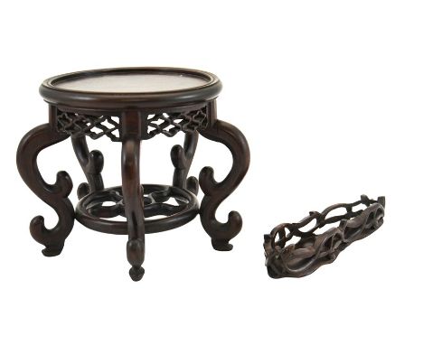 Two Chinese carved hardwood stands, reticulated friezes, one with a five spoked wheel uniting S scroll legs, 18cm high, 15.5c