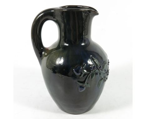 Edmund Harry Elton for Sunflower Pottery, an Elton Ware jug, shouldered form, relief moulded with poppy, blue marbled glaze, 