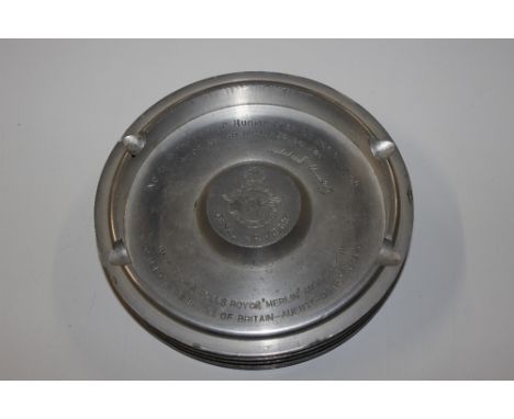 An RAF ash tray with inscription made from a Rolls Royce Merlin engine piston