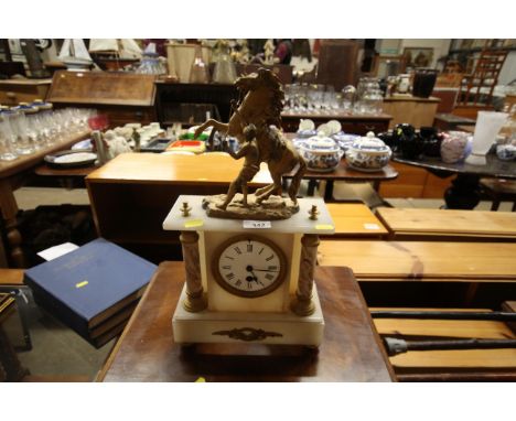 A mantel clock with figural decoration 