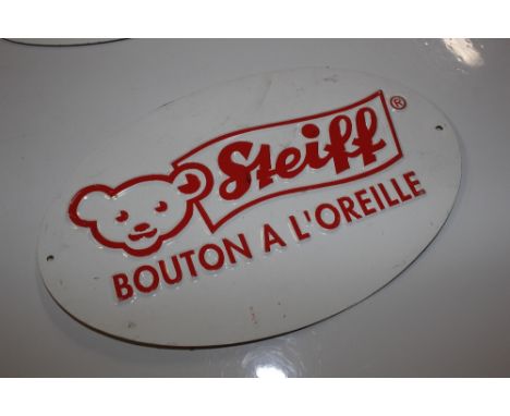 Four Steiff bear signs 