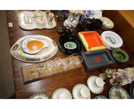 A Wills &amp; Sons Fine Shagg cribbage board, and a quantity of advertising ash trays 