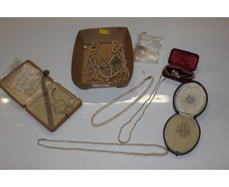 A collection of pearl and simulated pearl necklaces - some with yellow metal clasps 