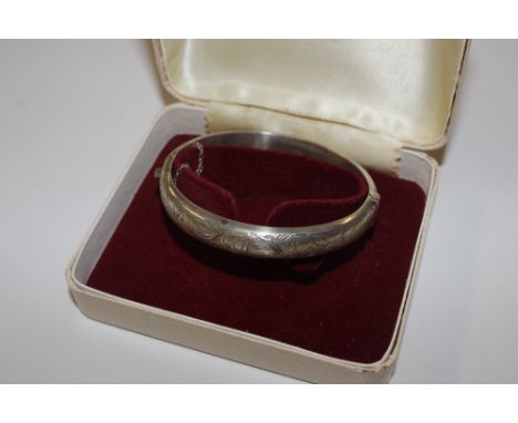 An engraved silver snap bangle Chester 1959