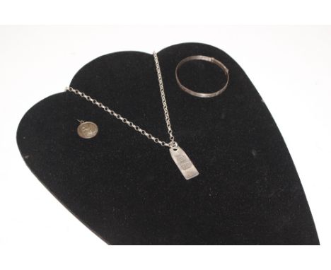 A silver ingot pendant, hung to a silver chair; a silver pendant and child's silver bangle 