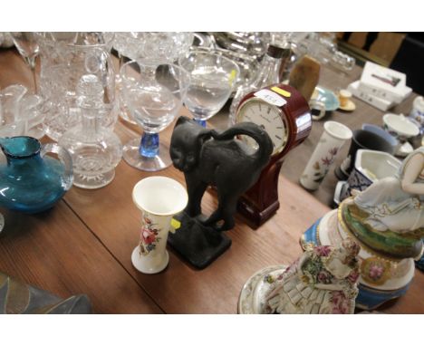 A reproduction balloon clock; and a door stop in the form of a cat; and a Royal Worcester floral decorated vase 