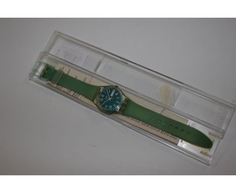 A Swatch green set wrist watch 