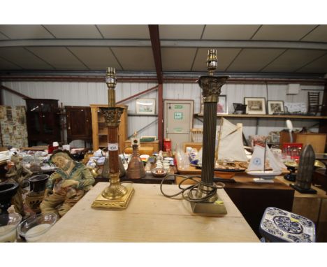 A brass Corinthian column table lamp and one other table lamp