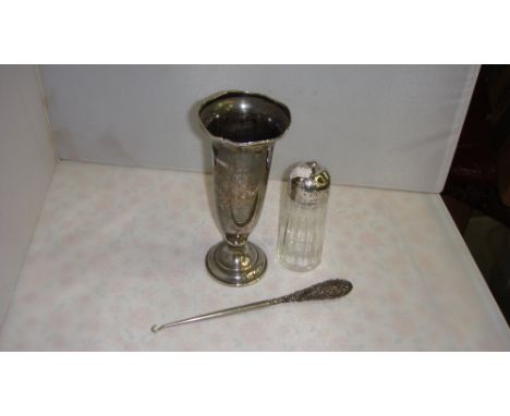 Filled silver trumpet vase, button hook and silver top sugar castor