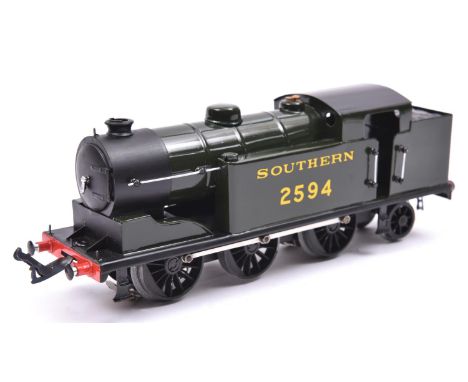 An O gauge electric tinplate Southern Railway 0-6-2T locomotive, 2594. Based on a Class N2 tank loco, this model was built as