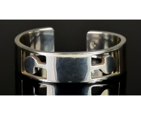 A Silver Bangle by Gucci, 170mm in circumference, gross weight 64g