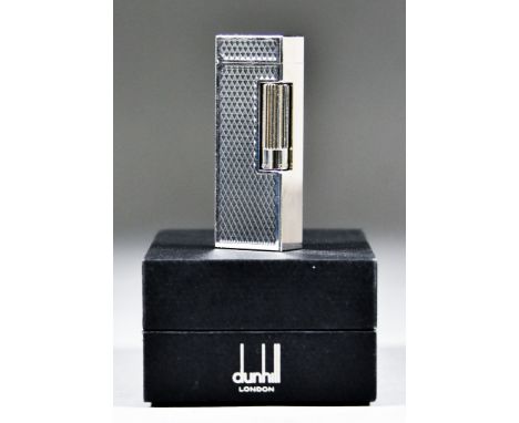 A Modern Dunhill Silvery Coloured Metal Cigarette Lighter, with engine turned designed body, in original fitted case with pap