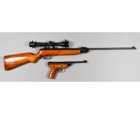 A .22 Calibre Air Rifle by Haenel, model 303, blue steel barrel, 19ins, blue steel action, light wood stock and fore end, ste