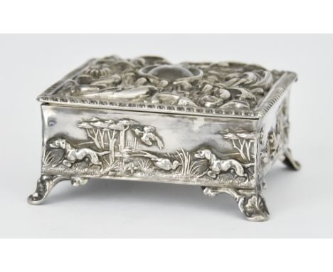 An Edward VII Silver Square Dressing Table Box by Thomas Hayes, Birmingham 1902, the cover with gadroon border profusely embo