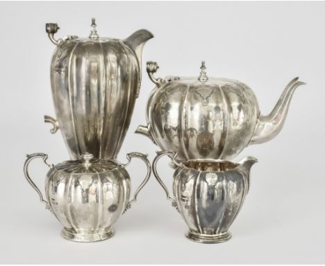 An Elizabeth II Silver Four-Piece Tea Service by William Greenwood &amp; Sons, Birmingham 1955, of melon shape, chased and en