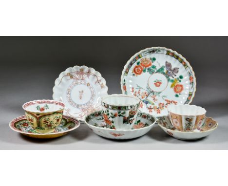 A Chinese Famille Verte and Cafe au Lait Porcelain Tea Bowl and Saucer, Kangxi Period,  decorated with panels of flowers with