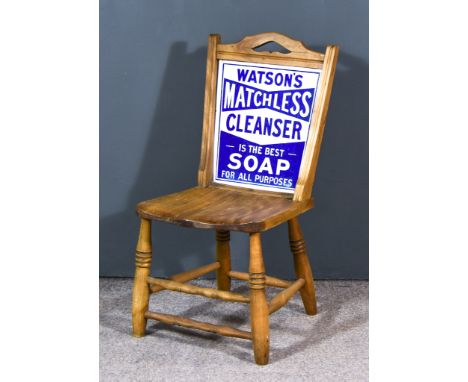 An Oak Advertising Chair, Early 20th Century, inset with a "Watson's" enamel advertising sign, worded "Watson's Matchless Cle