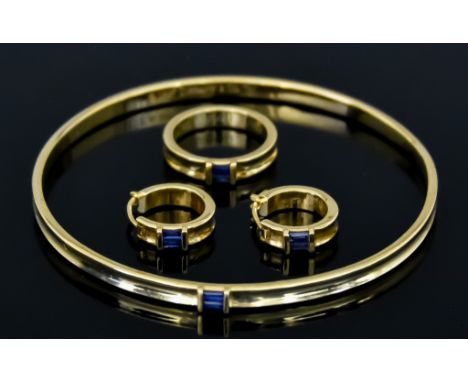 An 18ct Gold and Sapphire Suite, Modern, signed Tiffany &amp; Co., comprising - stiff bangle set with baguette cut sapphires,