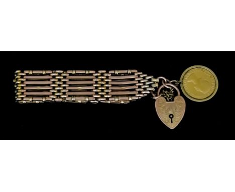 An Elizabeth II 1964 Sovereign, in 9ct gold mount on 9ct gold size bar gate bracelet, total gross weight 32.8g