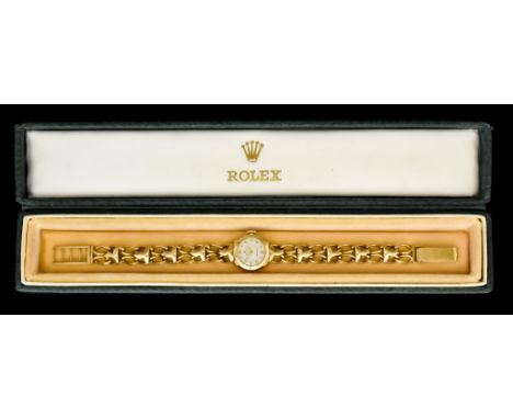 A Lady's Manual Wind Wristwatch, by Rolex, 9ct gold case, 27mm diameter, white dial with gold Arab baton numerals, integral g