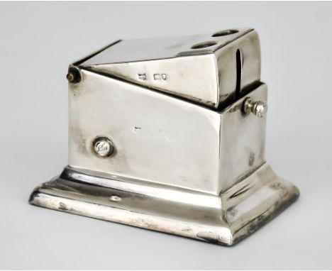 An Early 20th Century Silver Table Cigar Cutter by I W R, London, hallmarks rubbed, of rectangular form, the sprung cover wit