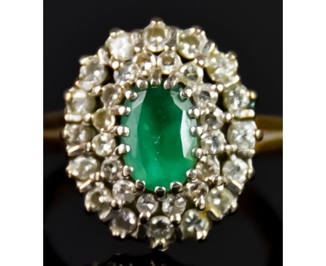 An 18ct Gold Emerald and Diamond Cluster Ring, 20th Century, set with a central emerald stone, approximately 1ct, surrounded 