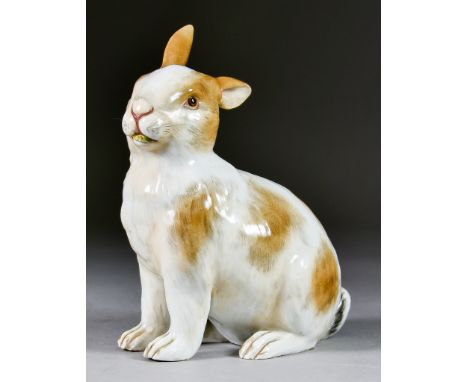 A Meissen Porcelain Model of a Rabbit, 19th Century, with brown patch decoration, 7ins high with blue crossed swords mark and