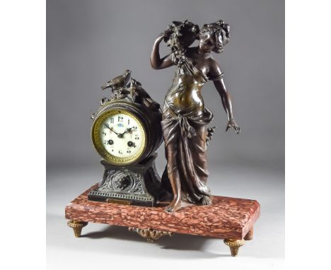 A Late 19th/Early 20th Century Bronzed Spelter Cased Mantel Clock No.89815, the 3.25ins diameter cream enamel dial with Arabi