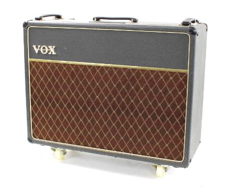 Vox AC30 guitar amplifier, made in England,&nbsp;circa 1963, ser. no. 12443T, with original cover, later castors added, missi
