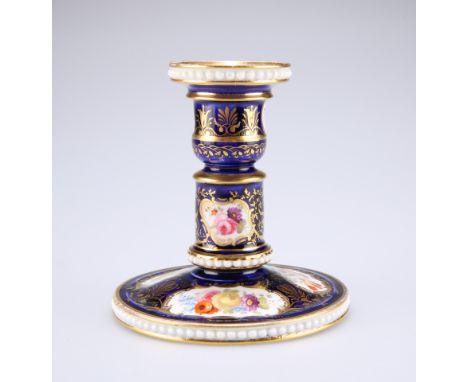 A DAVENPORT COBALT GROUND DWARF CANDLESTICK, CIRCA 1820,&nbsp;painted with tightly clustered flowers in gilt reserves and wit