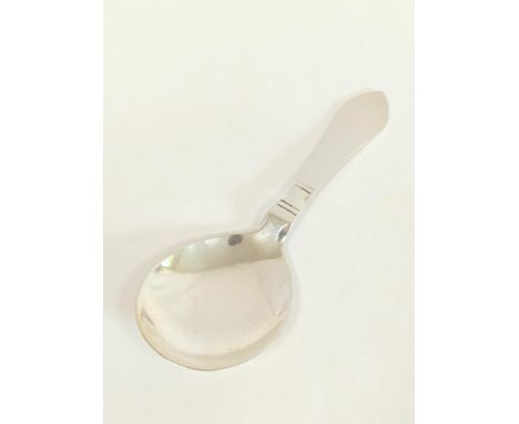 Silver caddy spoon with notched decoration by George Jensen, import marks 1925.&nbsp; 