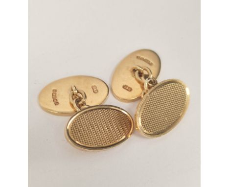Pair of 9ct. gold oval cufflinks, engine turned. 14.6g 