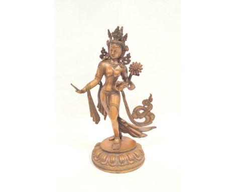 Sino-Tibetan patinated bronze figure of a female deity standing on oval lotus plinth base, 39cm high. 