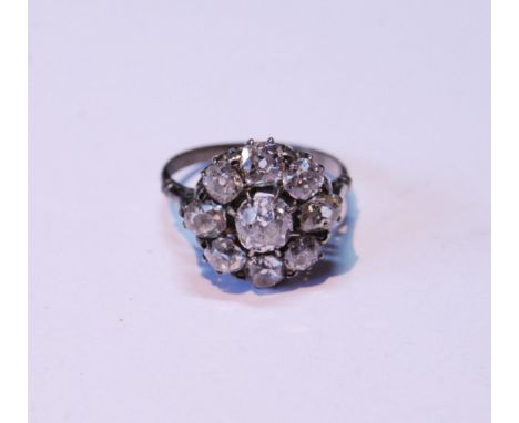 Early 20th century diamond cluster ring with old-cut brilliant, approximately .5ct, surrounded by eight others, each approxim