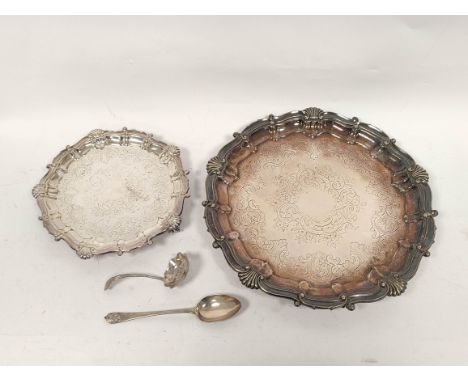 Pair of e.p waiters of Georgian style in sizes, and a silver spoon and ladle. (4) 