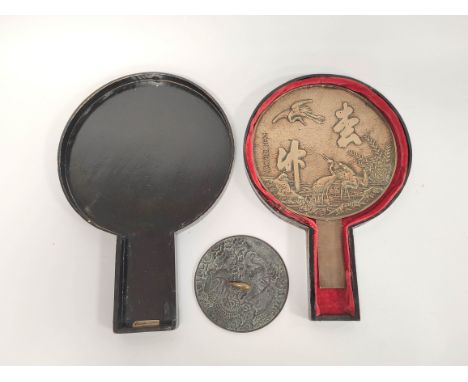 Japanese bronze hand mirror decorated with cranes and calligraphic character marks, 20cm diameter with similar disc, enclosed