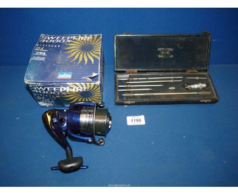 A Daiwa Sweep Fire 400x fishing reel and a cased machining instrument set.