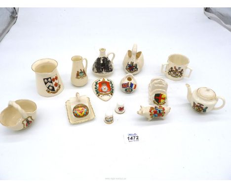 A small quantity of crested Goss ware including pig, tyg, swan, toast rack, teapot, etc.