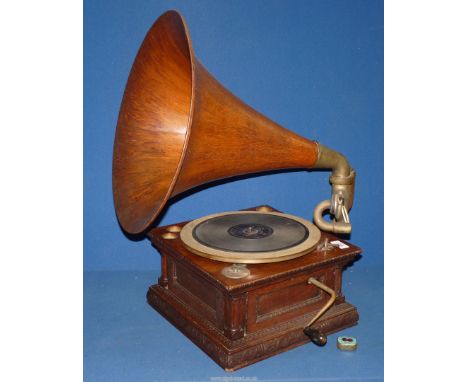 A vintage wind-up Gramophone with large wooden horn.
