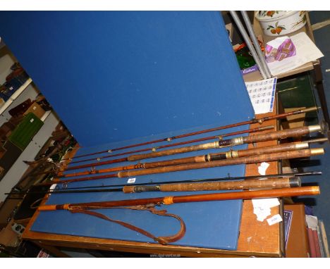 A quantity of vintage Fishing Rods, some cane, plus a fishing hook with leather strap (4 rods).