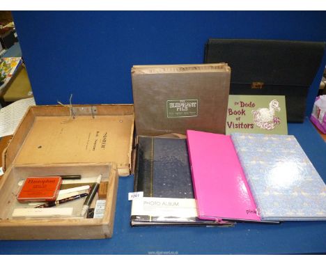 A quantity of vintage and modern stationery items including elephant file, desk secretary, notebooks, visitors book, vintage 