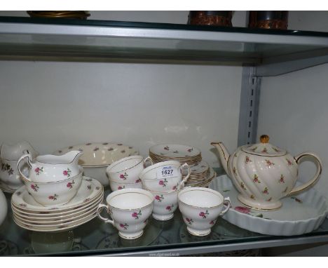 A white ground Teaset with pink rose decoration comprising six cups and saucers, cake plate, sugar bowl and cream jug, Sadler