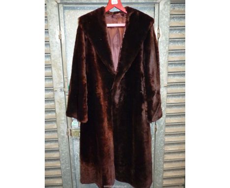 A vintage Martins of London fur coat, full length, brown beaver lamb and with original receipt .