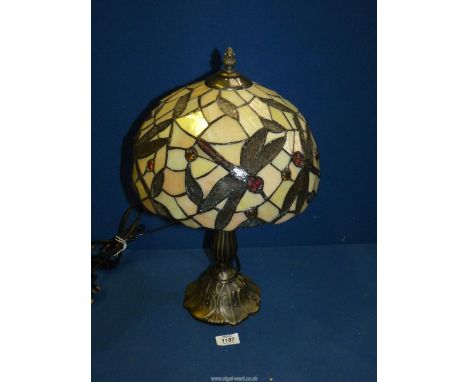 A contemporary Tiffany style Table Lamp with dragonfly decoration to the shade, 17 1/2'' tall, worked at time of cataloguing.