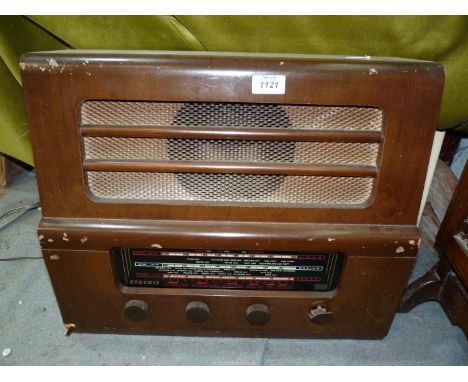 A vintage Etronic radio model no.ETA 6342, some damage to case and central knobs.