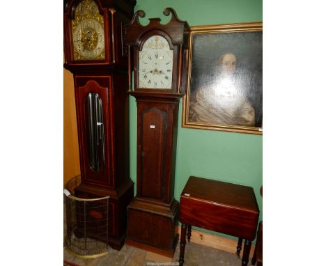 A cross-banded Oak cased Longcase Clock having a painted face with Roman hour numerals and Arabic minutes with an inset secon